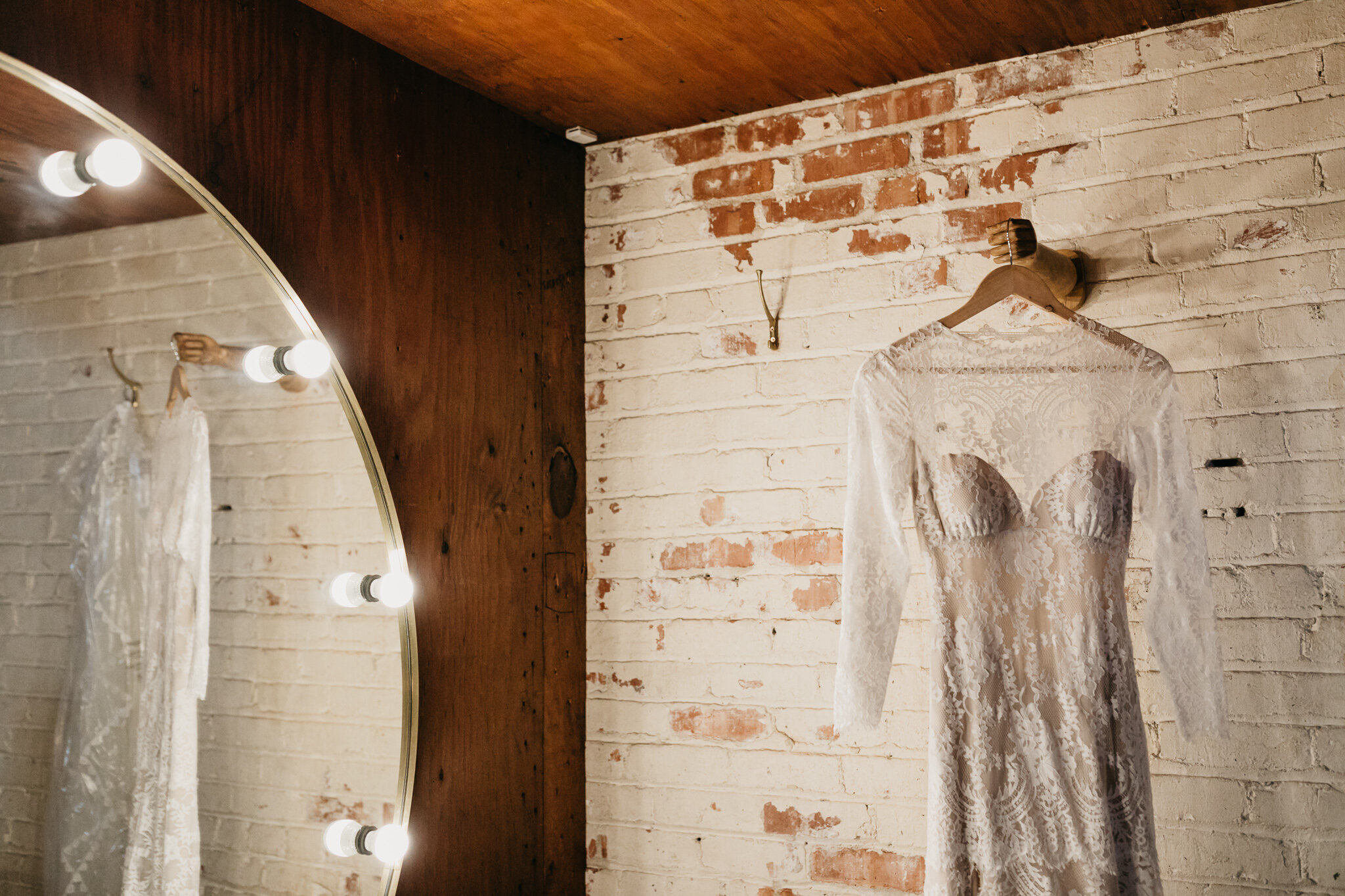 Wedding dress hanging in bridal suite of The Millwick in Downtown Los Angeles, CA