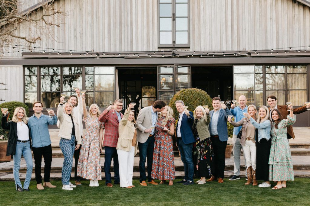 family and friends cheer on newly engaged couple at the napa valley reserve