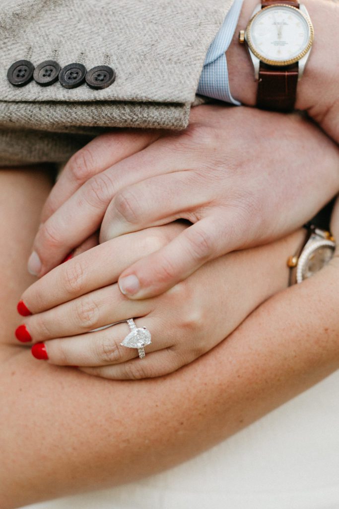bride wears 3.5 carat custom pear cut diamond engagement ring